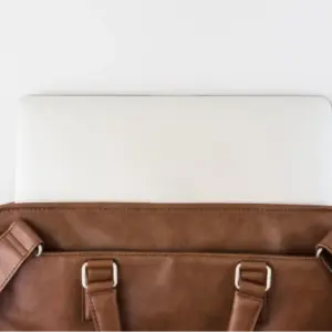 Brown briefcase with tablet
